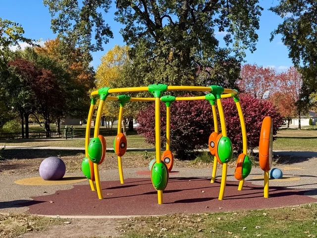 a view of a lake with houses in the background