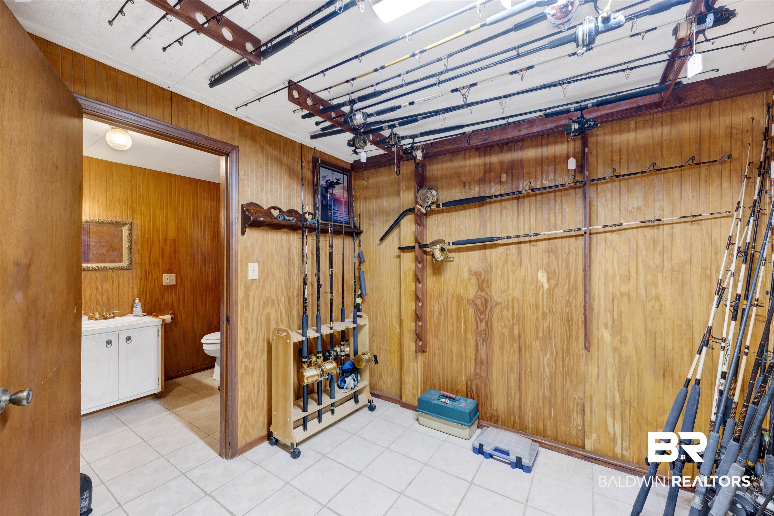 26222 Marina Road Orange Beach, AL 36561 - Photo 29 of 38 Bathroom with vanity and wood walls