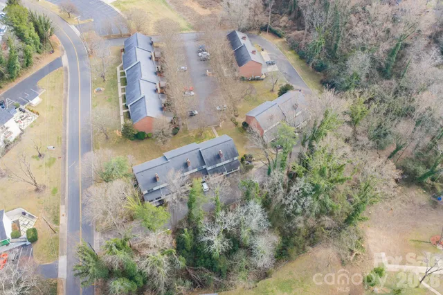 an aerial view of waterside residential houses with outdoor space