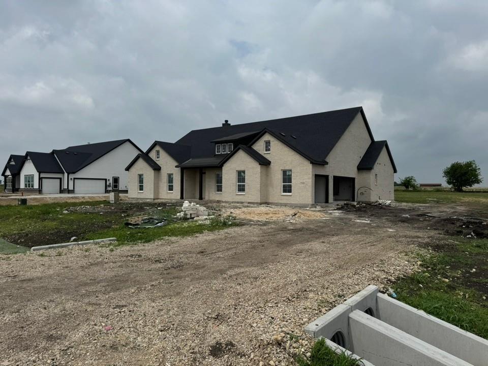 2305 Quartz Street Krum, TX 76249 - Photo 4 of 18 a view of house with wooden fence
