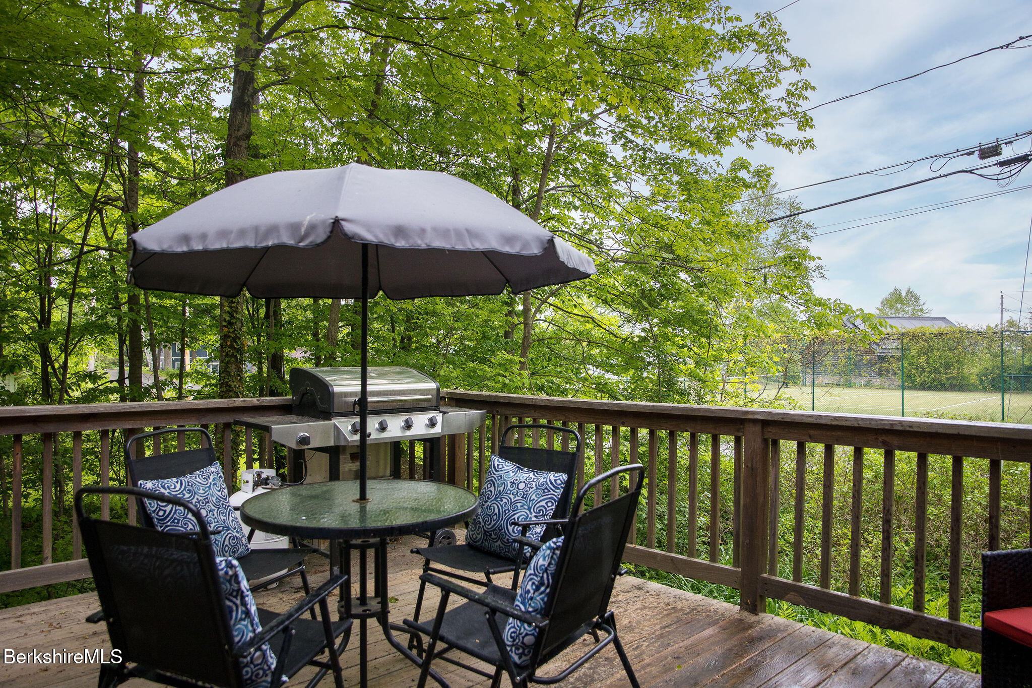 a view of balcony with outdoor seating and wooden floor