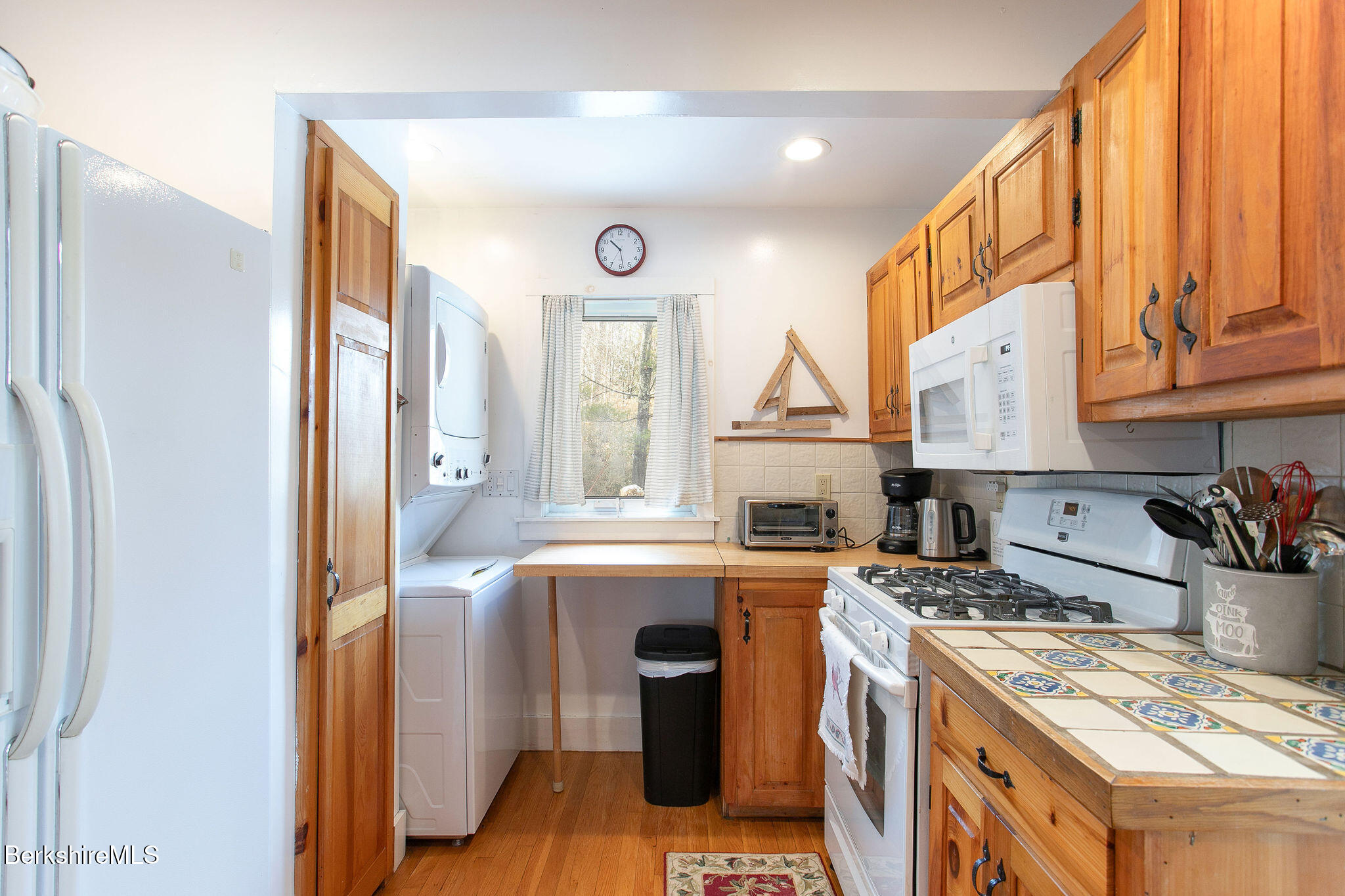 10 Elm Road Richmond, MA 01201 - Photo 16 of 32 a kitchen with stainless steel appliances granite countertop a sink stove and refrigerator