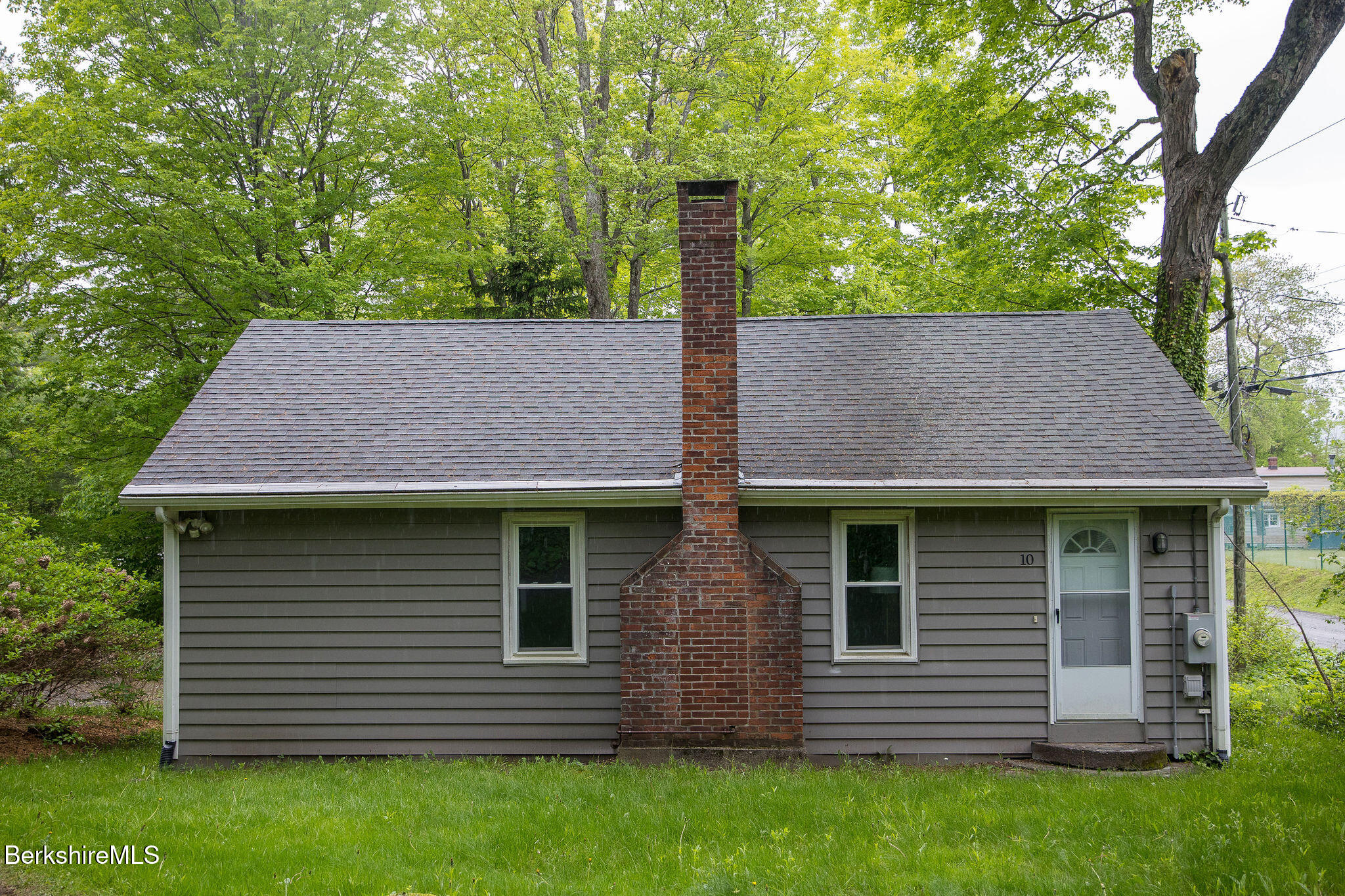 10 Elm Road Richmond, MA 01201 - Photo 2 of 32 a front view of a house with a garden