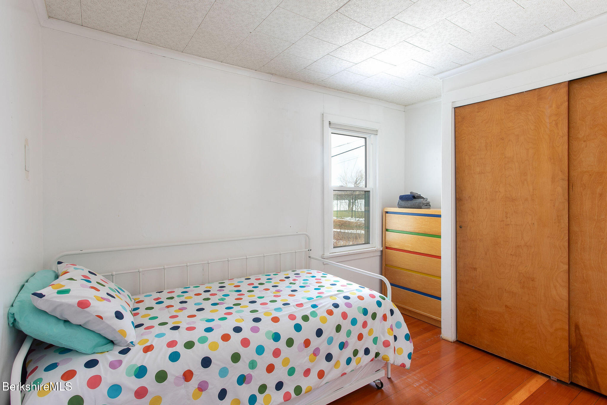 10 Elm Road Richmond, MA 01201 - Photo 24 of 32 a bedroom with a bed and wooden floor