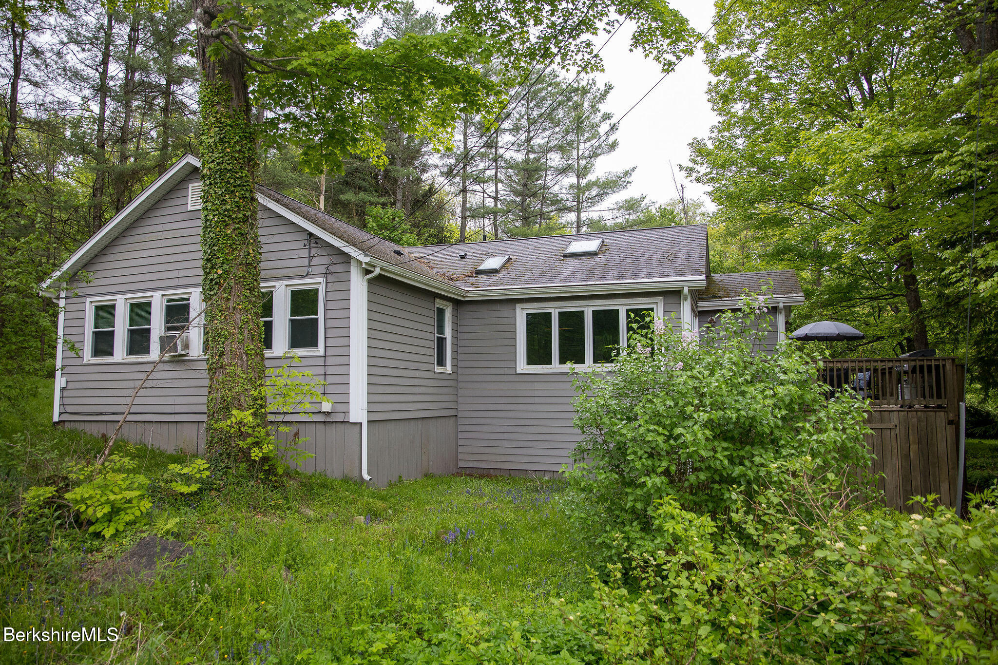 10 Elm Road Richmond, MA 01201 - Photo 4 of 32 a front view of a house with a garden