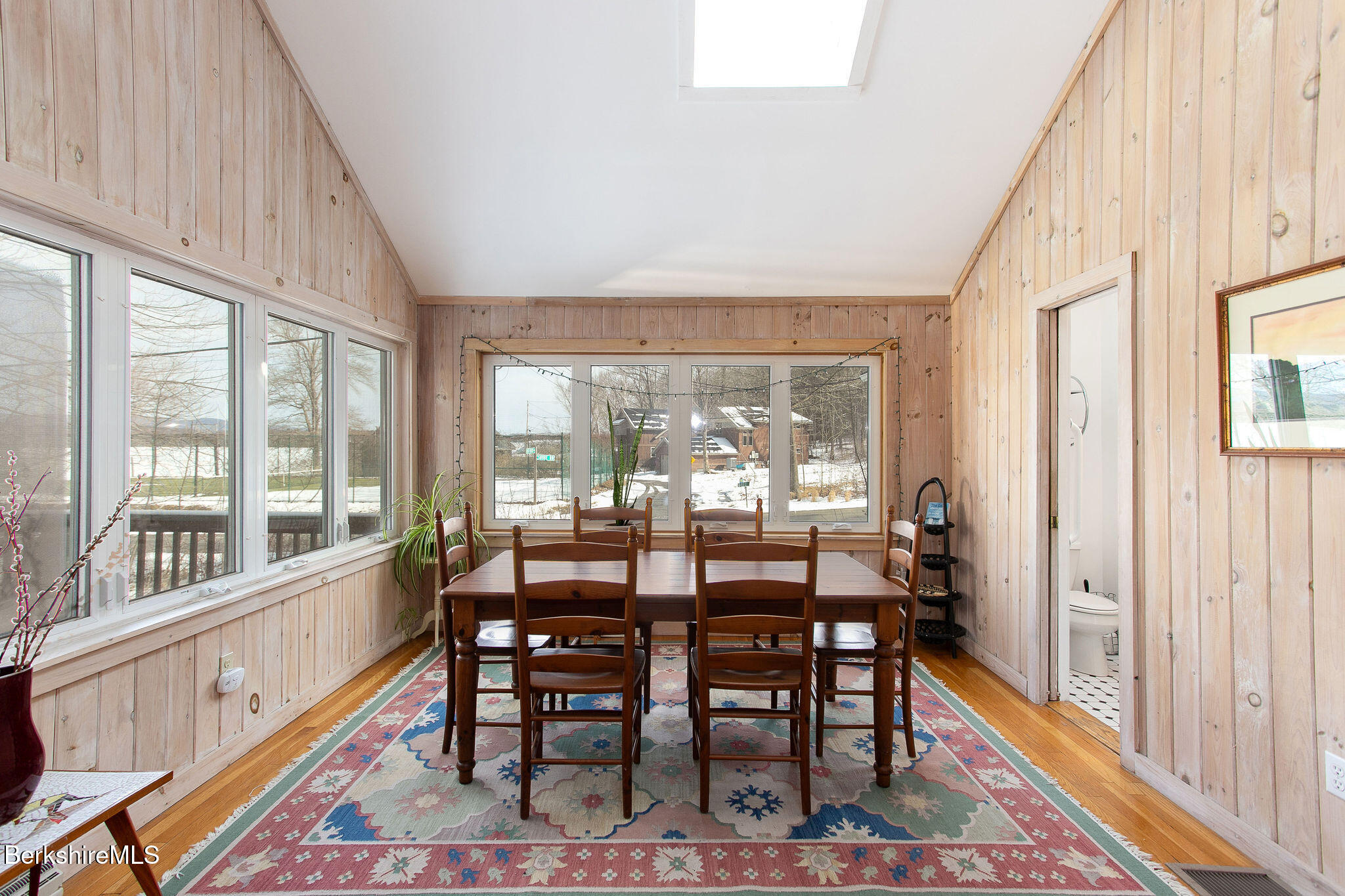 10 Elm Road Richmond, MA 01201 - Photo 9 of 32 a dining room with furniture a rug and wooden floor