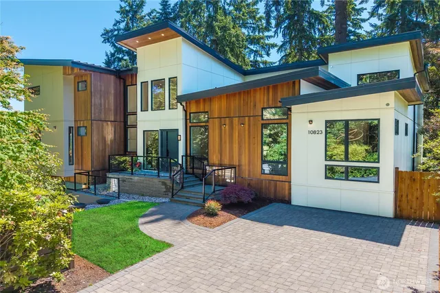 a backyard of a house with yard and outdoor seating