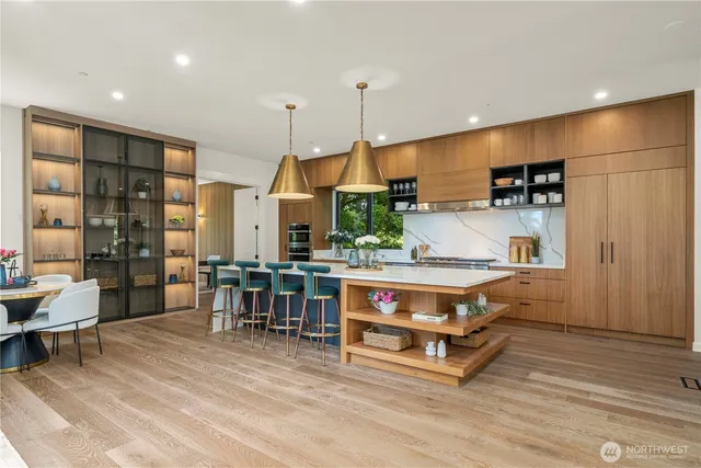 a living room with stainless steel appliances kitchen island granite countertop furniture and a kitchen view