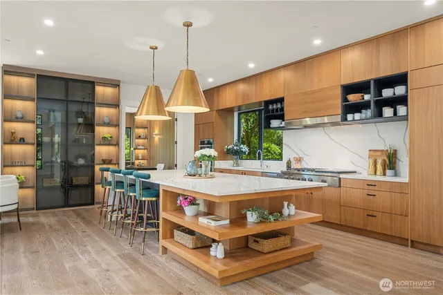 a large kitchen with lots of counter space a sink and appliances