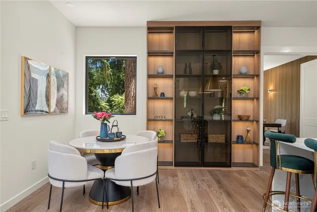 a dining room with furniture and window