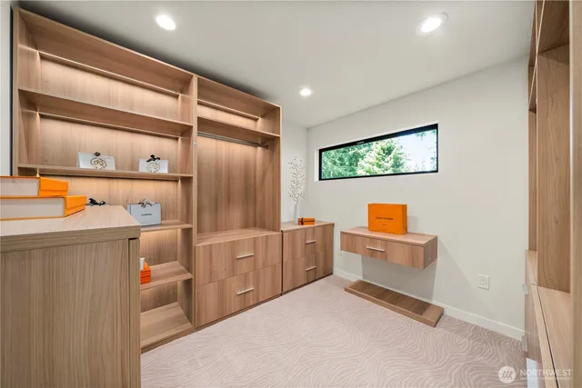 a bedroom with furniture and a window