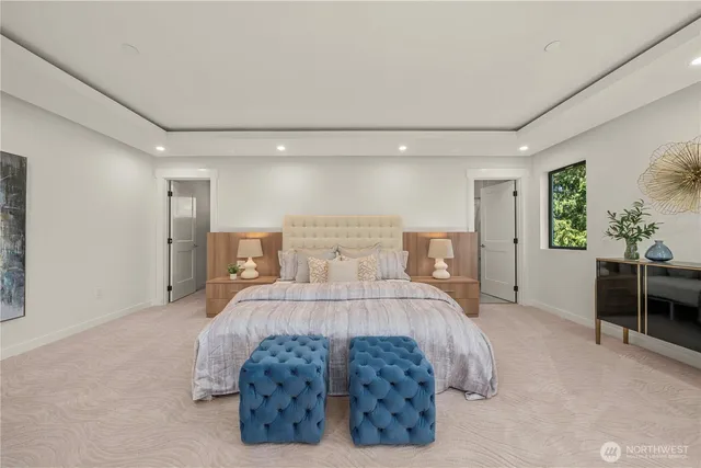 a bed room with a bed and potted plant on dresser