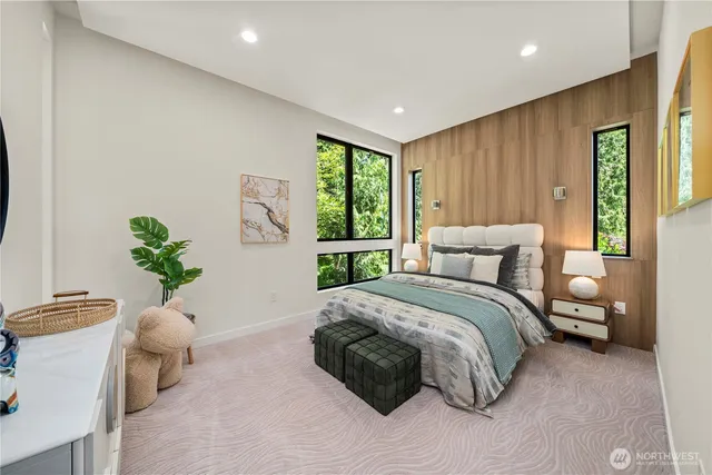 a spacious bedroom with a bed and a window