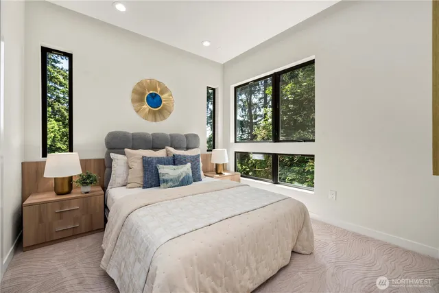 a bedroom with a large bed and a window