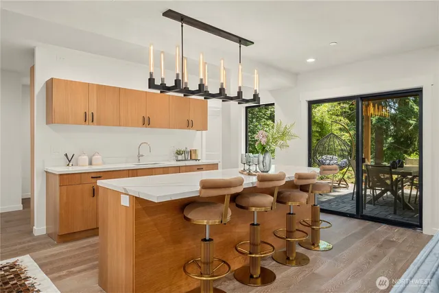 a kitchen with stainless steel appliances granite countertop a sink and cabinets