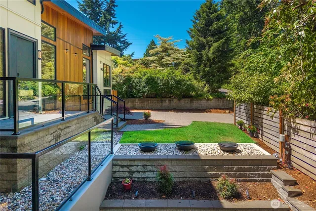 a view of a backyard with sitting area