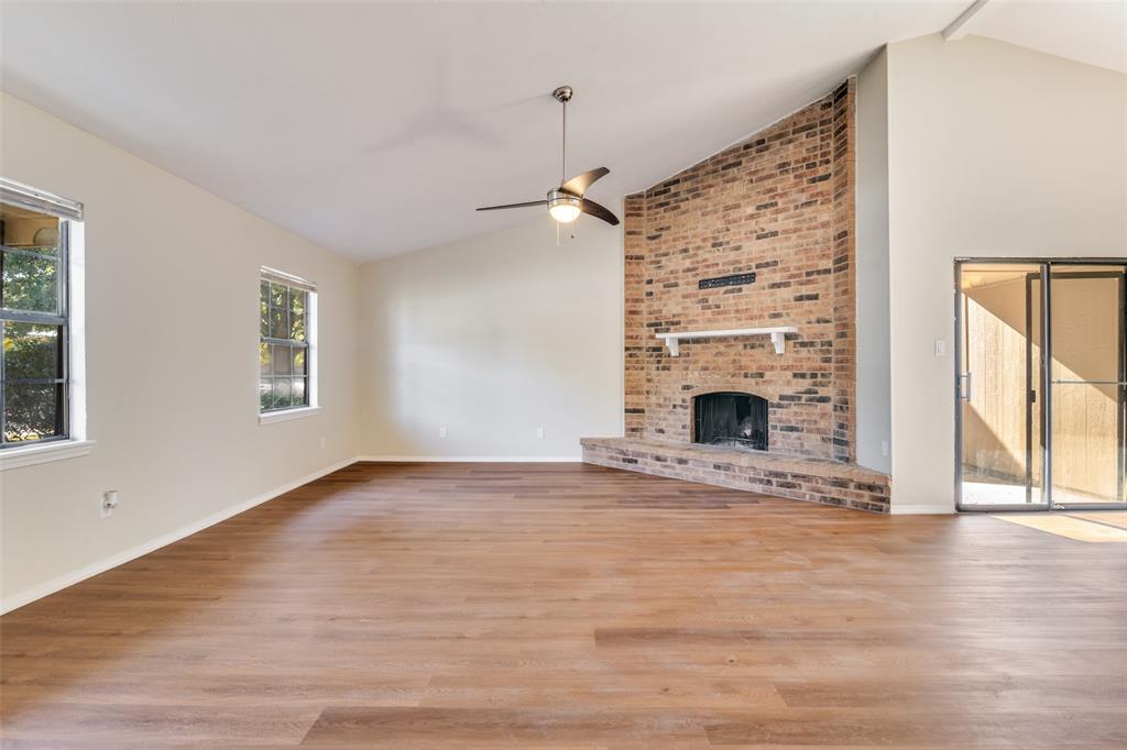 4017 Coryell Way Mesquite, TX 75150 - Photo 2 of 13 a view of an empty room with wooden floor and a window