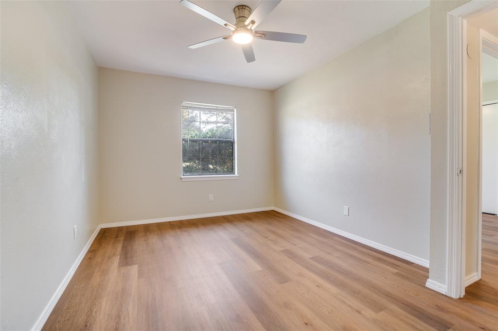 4017 Coryell Way Mesquite, TX 75150 - Photo 7 of 13 wooden floor in an empty room with a window