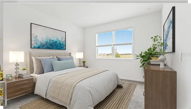 a bedroom with bed and a potted plant