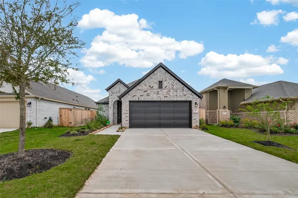 a front view of a house with yard