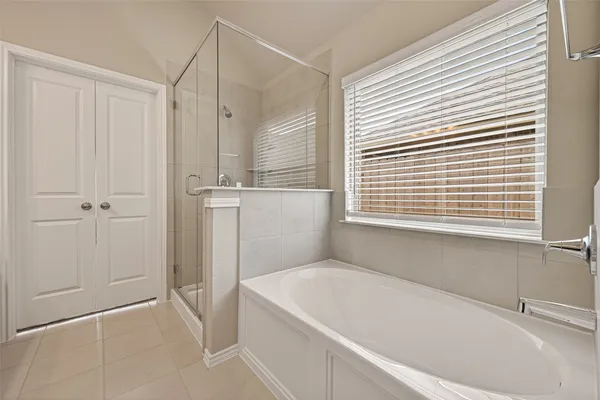 a white bath tub sitting next to a window