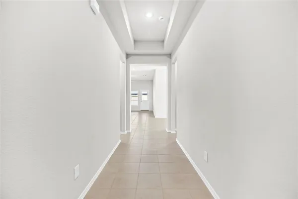 a view of a hallway with a white walls