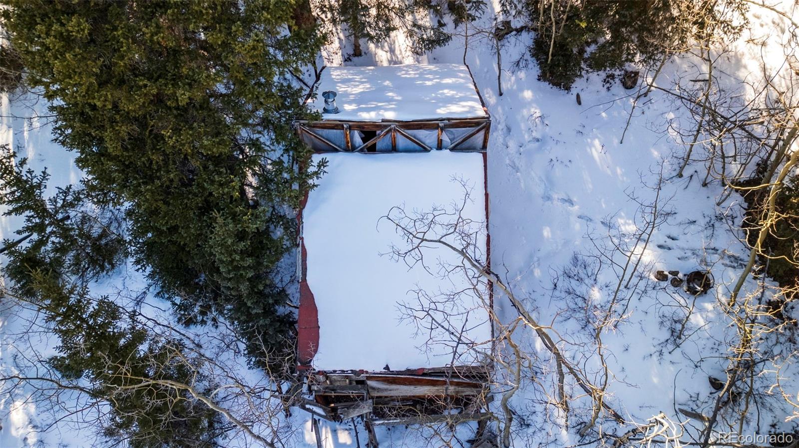 944 Roberts Road Alma, CO 80420 - Photo 12 of 30 an aerial view of a house with a yard and large tree
