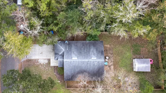 an aerial view of residential house with outdoor space