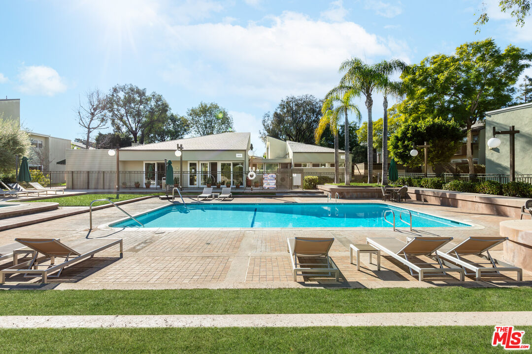4804 Hollow Corner Road, Unit 125 Culver City, CA 90230 - Photo 27 of 43 a view of a house with swimming pool and yard