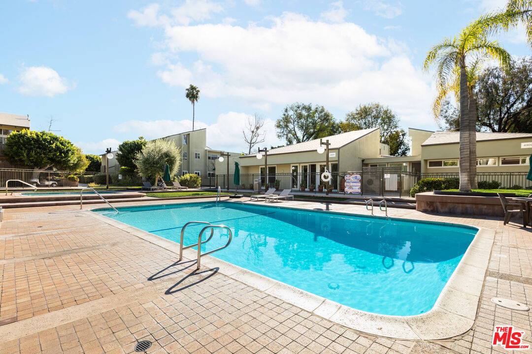 4804 Hollow Corner Road, Unit 125 Culver City, CA 90230 - Photo 29 of 43 a view of a swimming pool with a lounge chairs