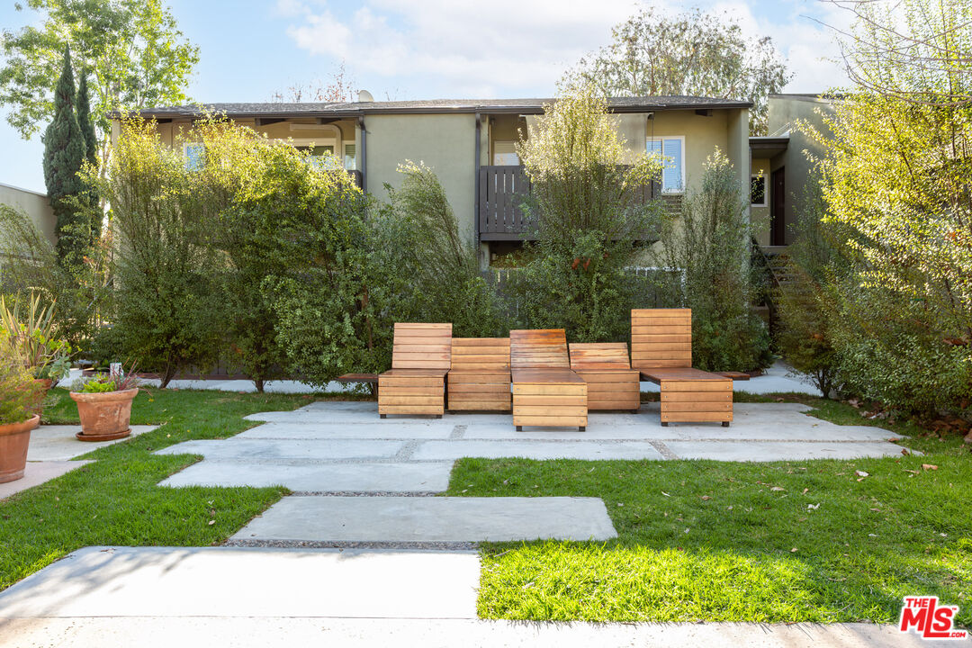 4804 Hollow Corner Road, Unit 125 Culver City, CA 90230 - Photo 32 of 43 a view of a chair and table in the garden