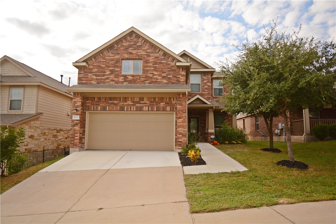 10220 Copper Ridge Cove Austin, TX 78747 - Photo 1 of 1 a front view of house with yard