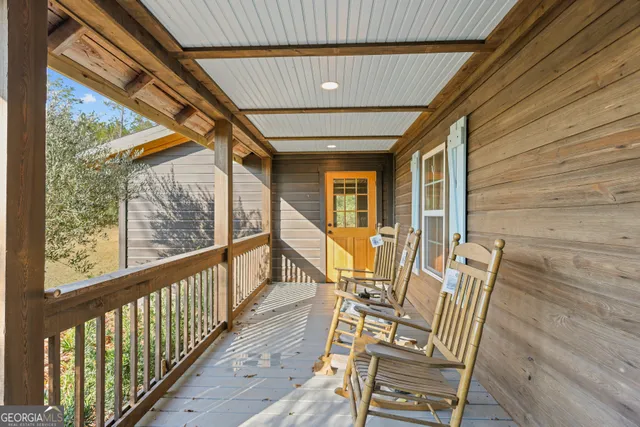 a view of deck with furniture and wooden floor