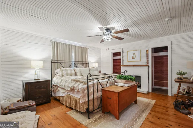 a spacious bedroom with a bed and a couch