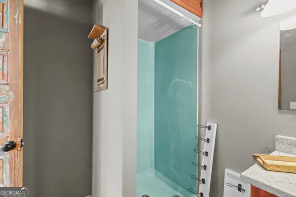 a bathroom with a bathtub and a shower