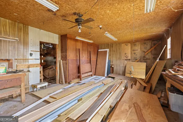 a bedroom with a bed a desk and chair