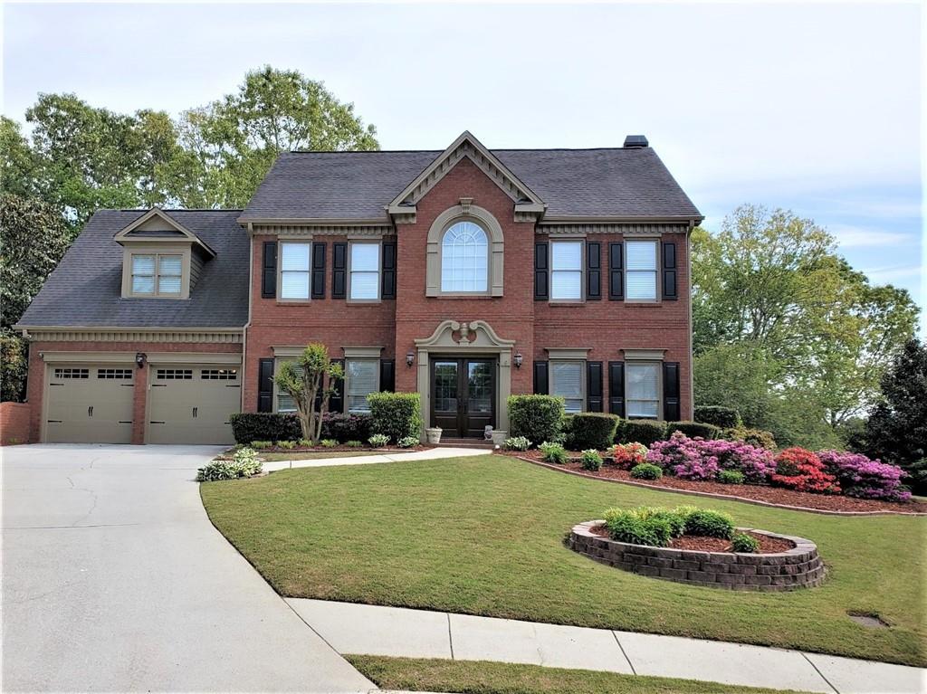 1689 Praters Point Dacula, GA 30019 - Photo 1 of 1 Stately home and gardens on lovely cul-de-sac!