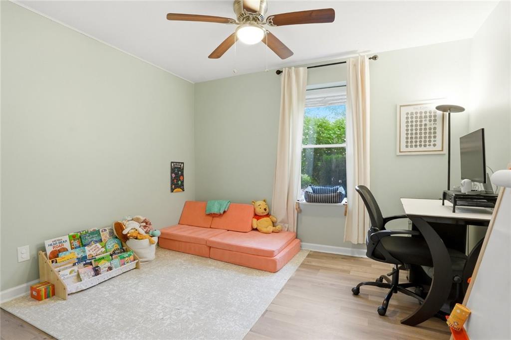 1430 Thomas Road Decatur, GA 30030 - Photo 24 of 42 a bedroom with a bed and a window