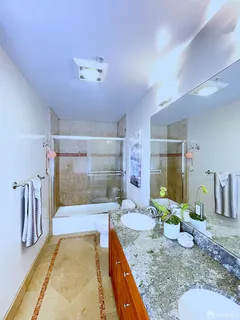 a view of a living room and bathroom