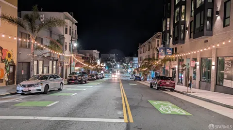 a view of a street with cars