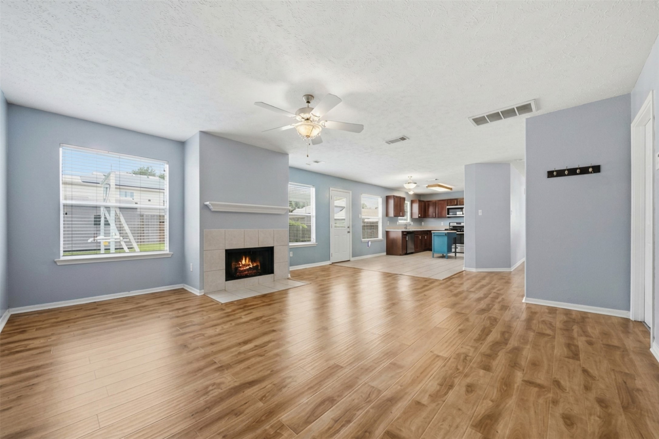 2446 Halstead Drive Spring, TX 77386 - Photo 13 of 45 The fireplace is a lovely focal point of the family room that is open to the kitchen & breakfast room creating the perfect space for gathering.