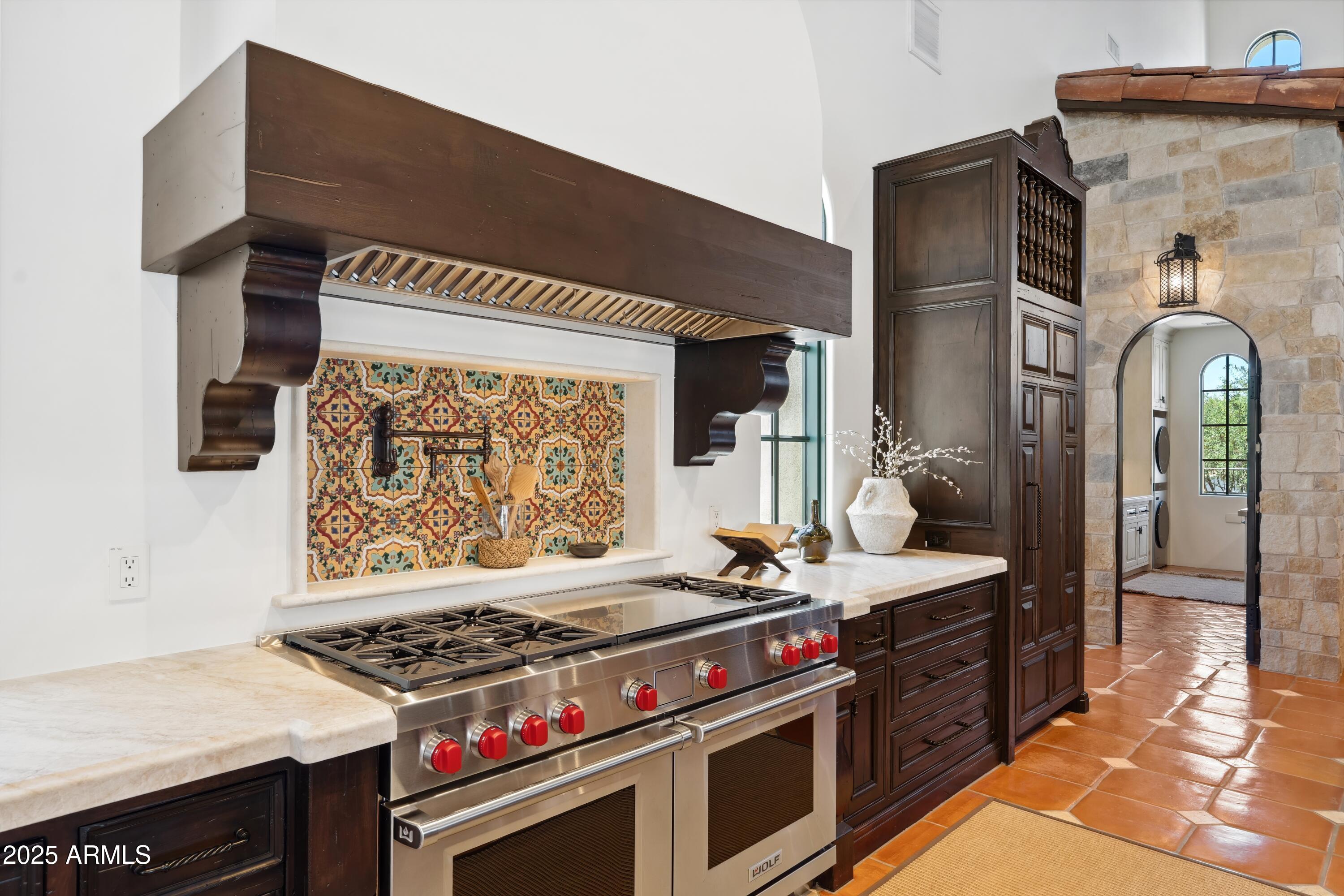 21868 East Stacey Road Queen Creek, AZ 85142 - Photo 16 of 146 a kitchen with stainless steel appliances granite countertop a stove and a sink