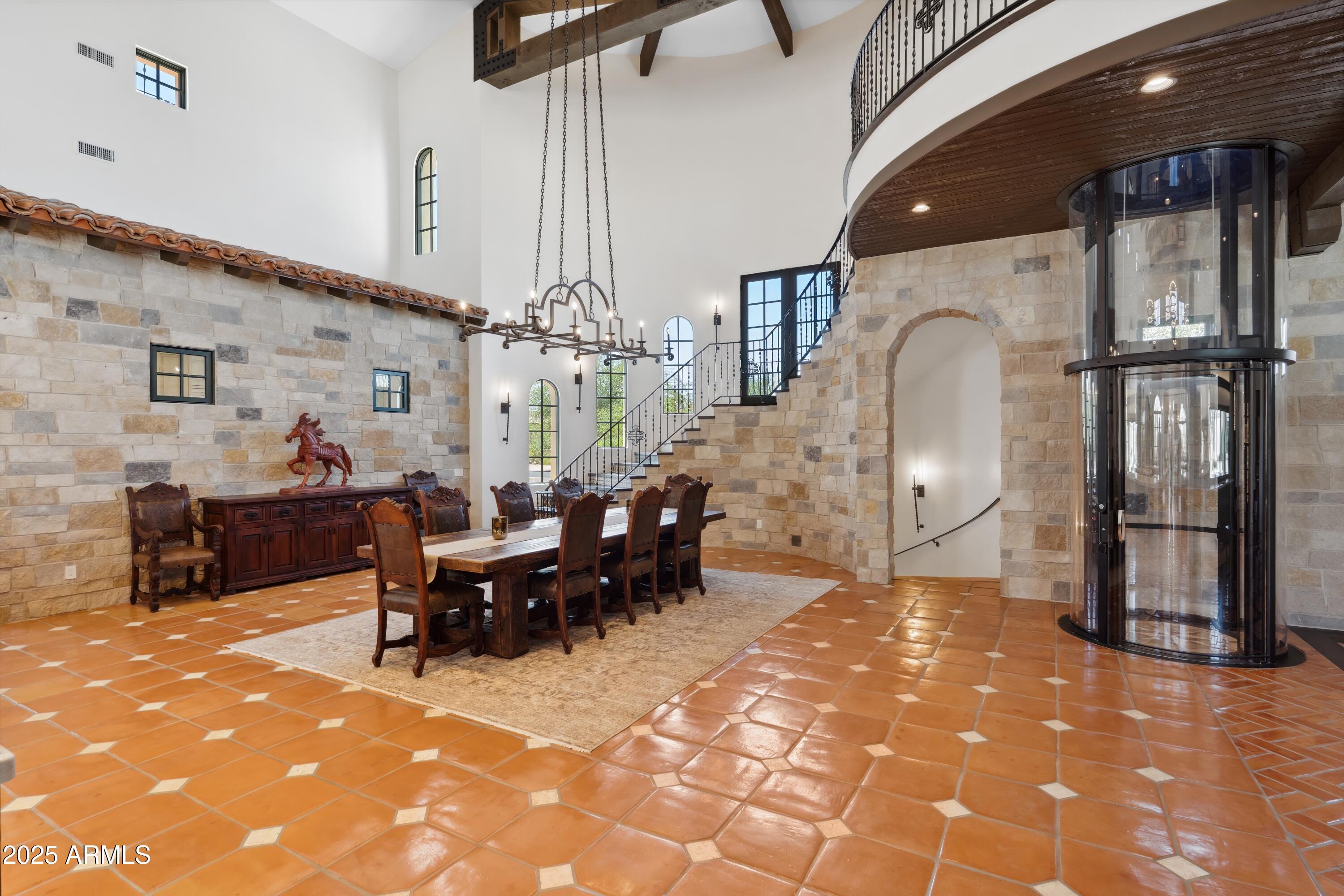 21868 East Stacey Road Queen Creek, AZ 85142 - Photo 26 of 146 a living room with furniture a chandelier fan and a dining table