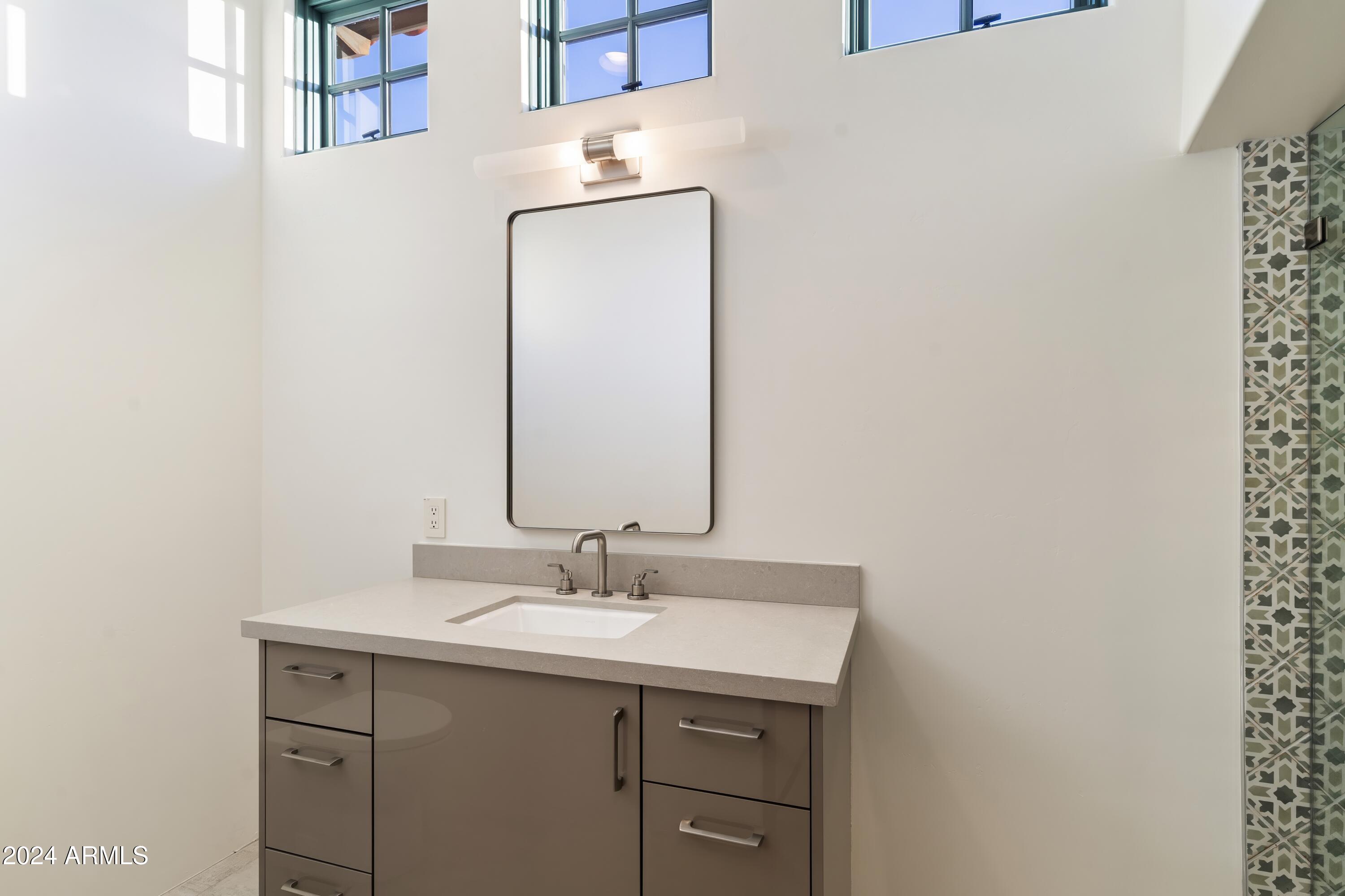 21868 East Stacey Road Queen Creek, AZ 85142 - Photo 45 of 155 a bathroom with a sink and a mirror