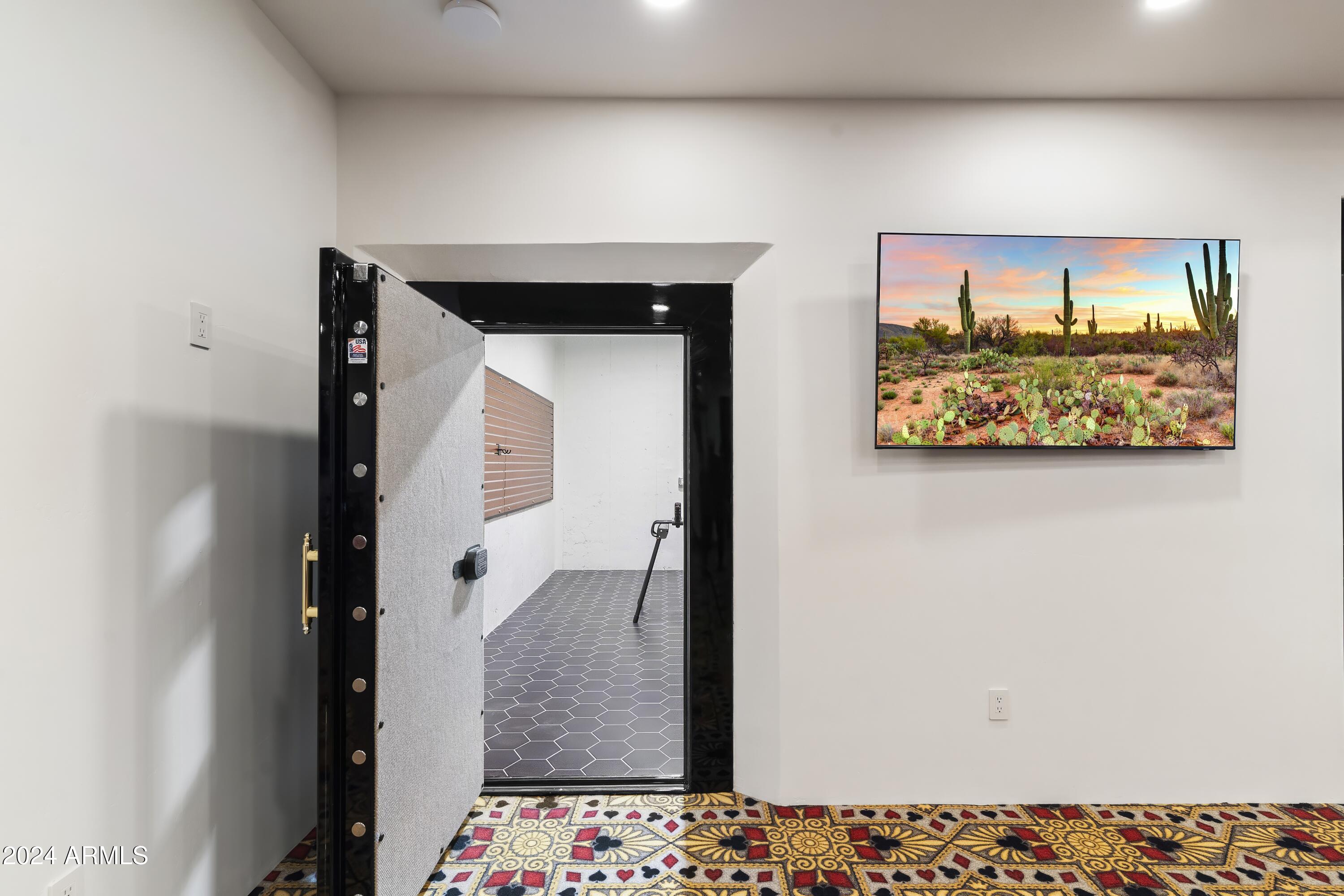 21868 East Stacey Road Queen Creek, AZ 85142 - Photo 54 of 155 a view of hallway with a large mirror and a wooden floor