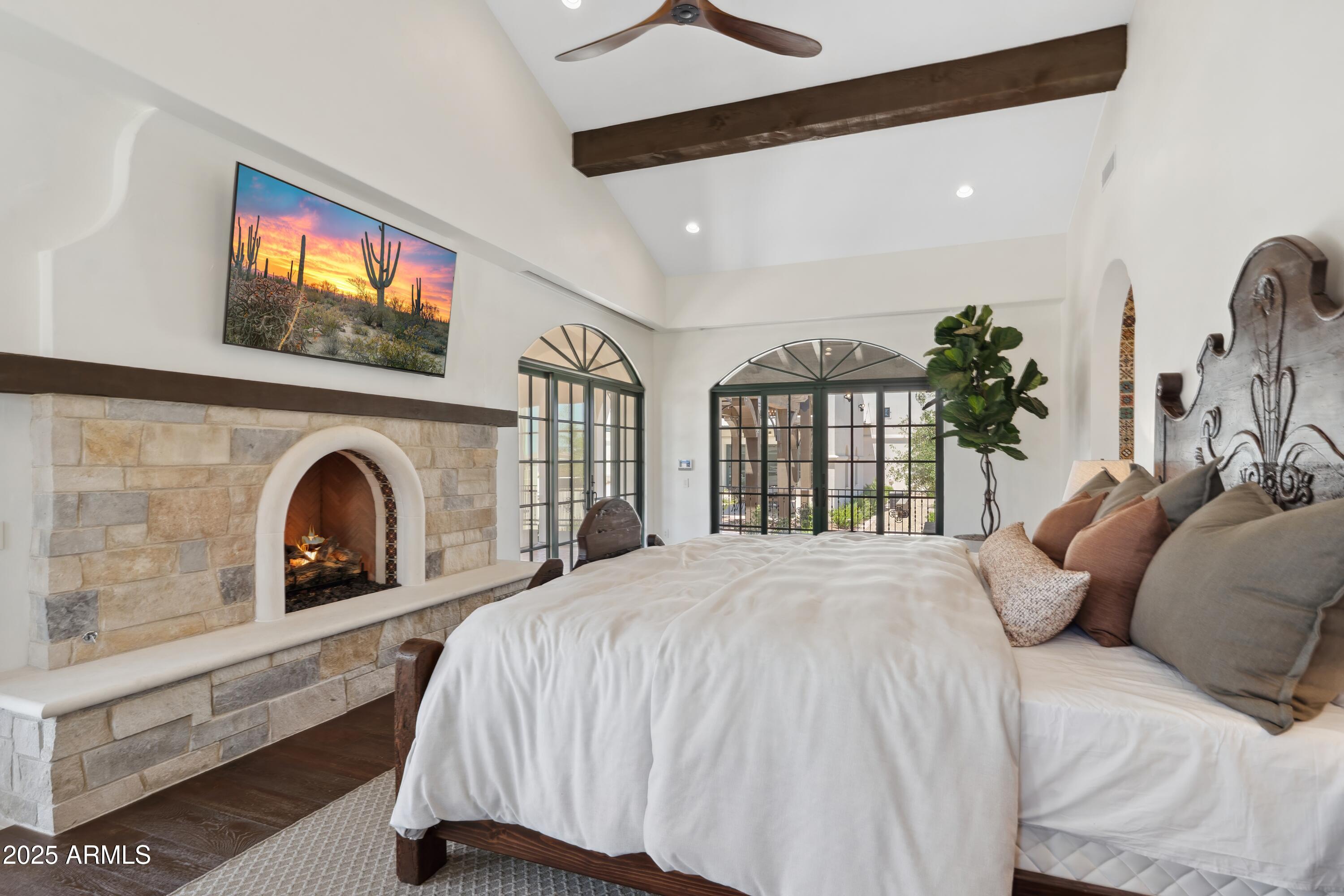 21868 East Stacey Road Queen Creek, AZ 85142 - Photo 65 of 155 a bed room with a bed and a fireplace