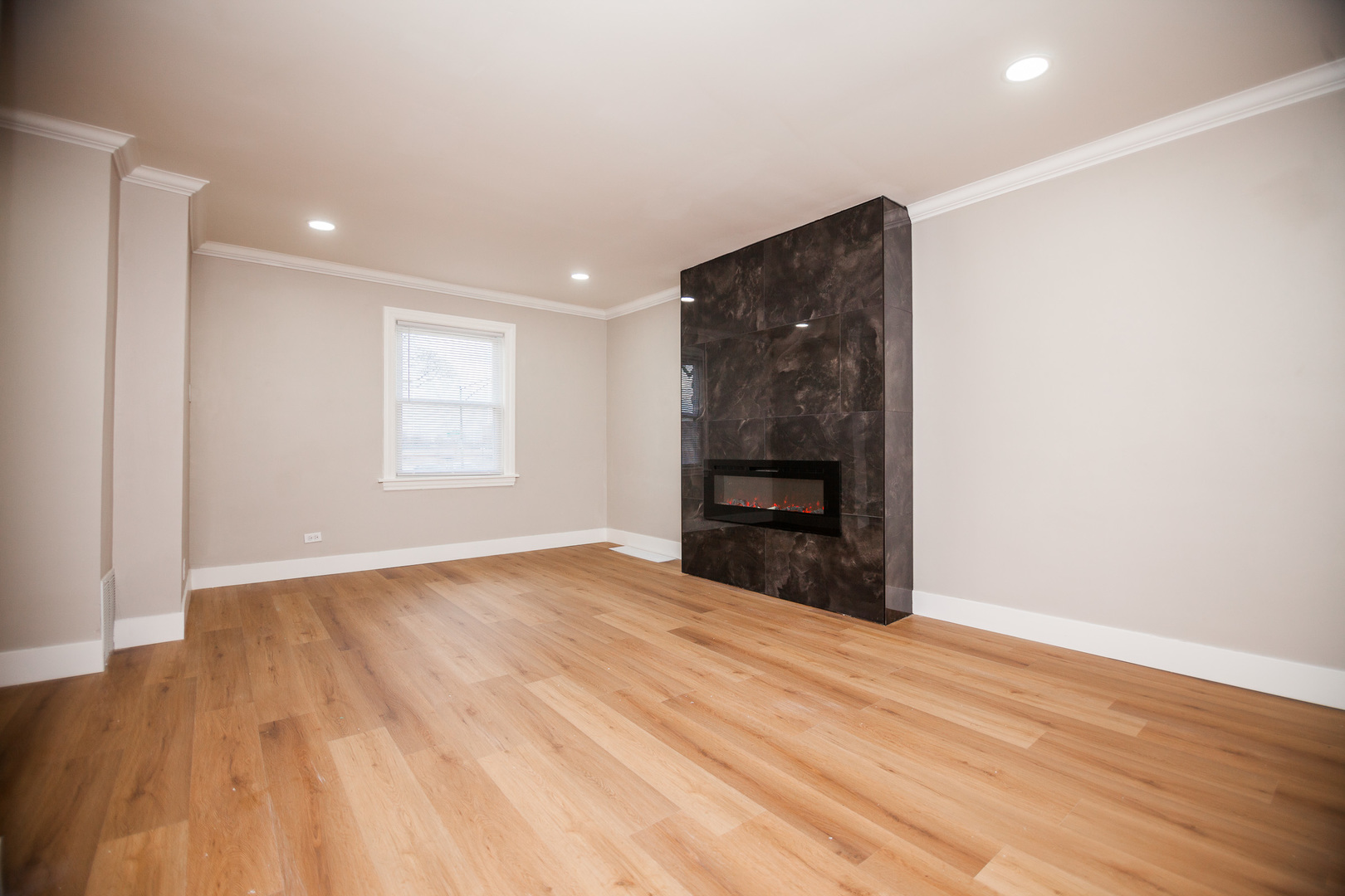 1156 West 102nd Street Chicago, IL 60643 - Photo 13 of 29 a view of an empty room with wooden floor and a window