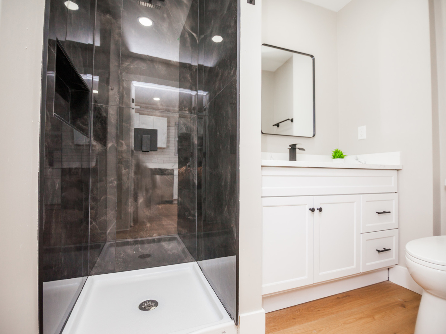 1156 West 102nd Street Chicago, IL 60643 - Photo 23 of 29 a bathroom with a sink a toilet and shower