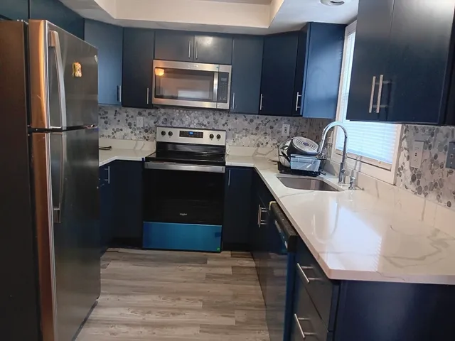 a view of livingroom with hardwood floor and a window