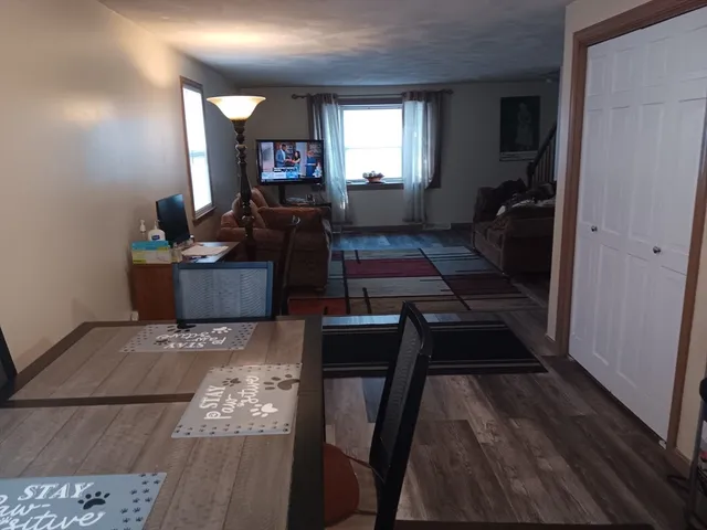a bathroom with a toilet and a shower curtain